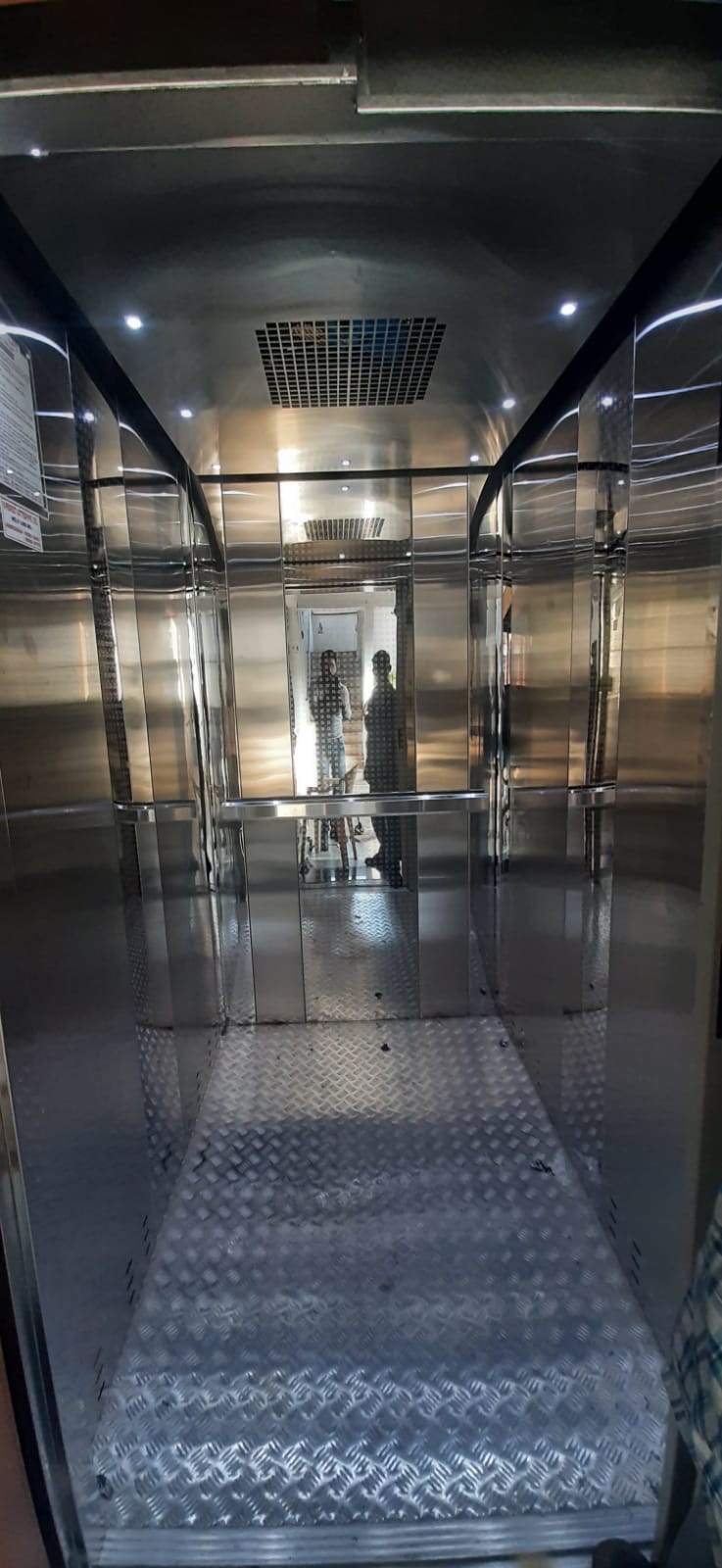 Stretcher elevator with stainless steel interior and checkered floor