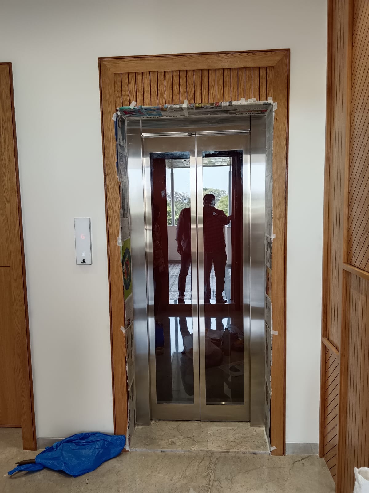 Wooden-framed stainless steel automatic door